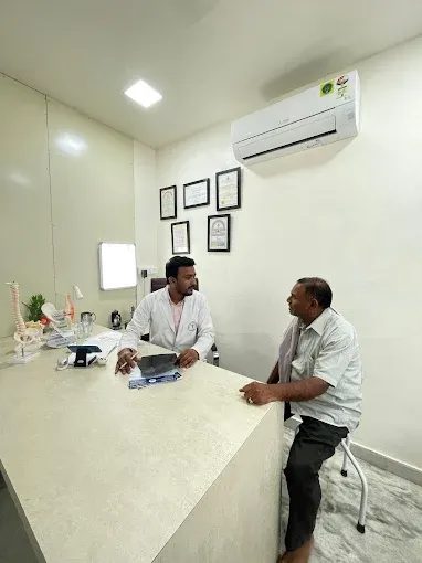 Dr. Nikhil consulting a patient